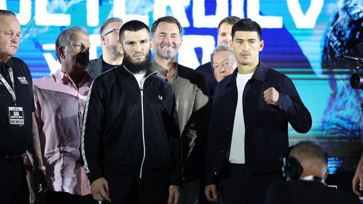 Artur Beterbiev and Dmitry Bivol stand side by side