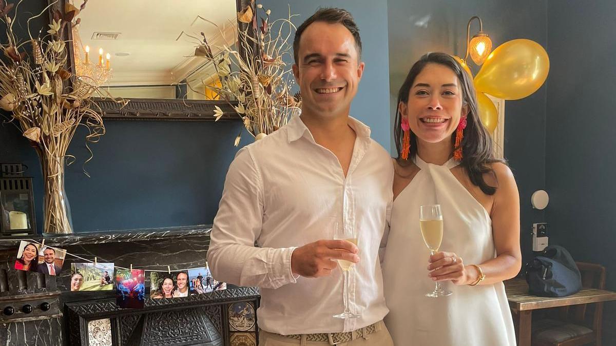 Max Stechman and Maria Penaloza holding glasses