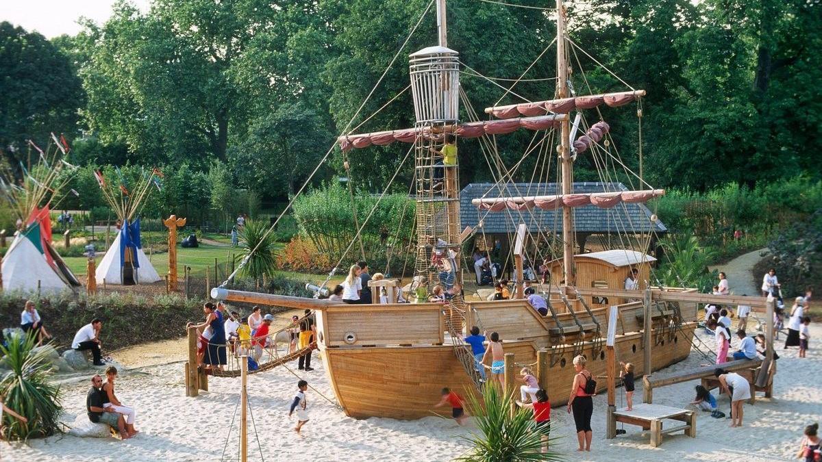 Children playing on a pirate ship in the memorial playground.