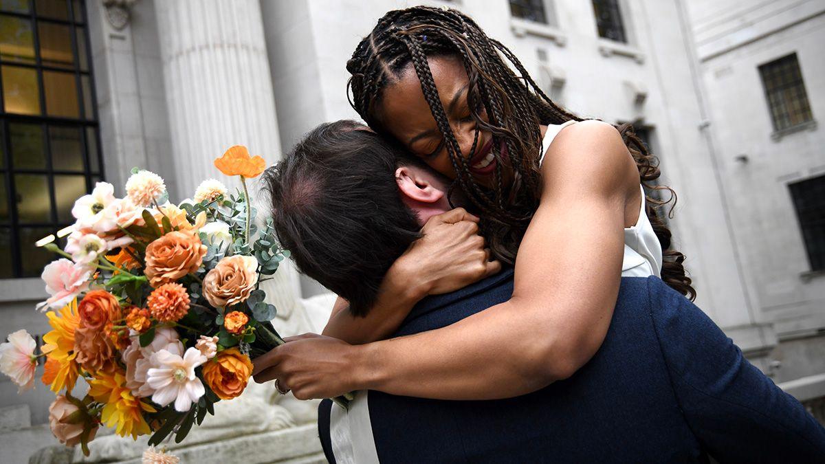 Natasha Whitter and Connor Lynch hug outside the venue