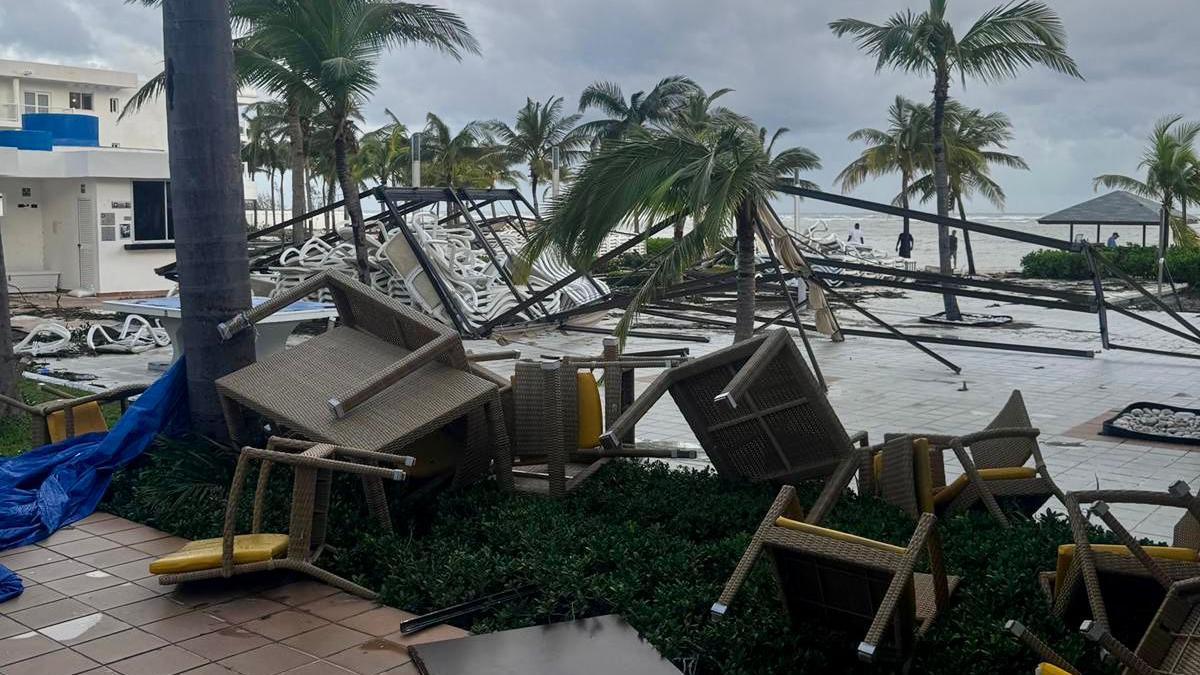 Upended outdoor furniture outside a hotel in the aftermath of Hurricane Melissa.