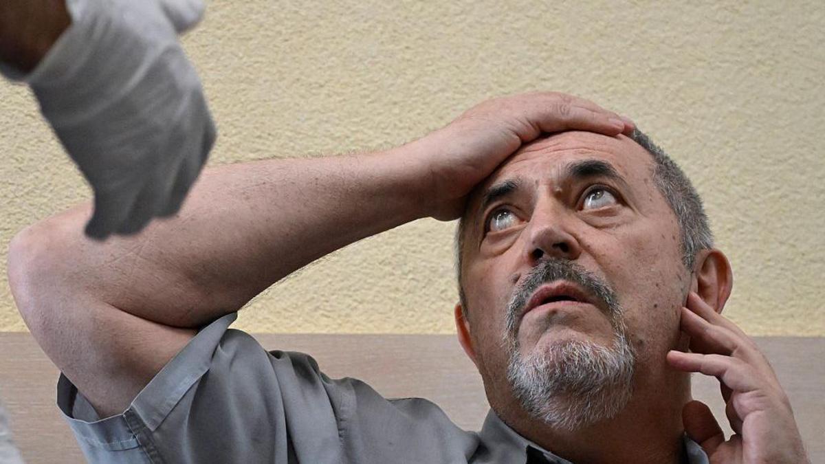 One anti-war critic fined, another held as Russia clamps down on dissent