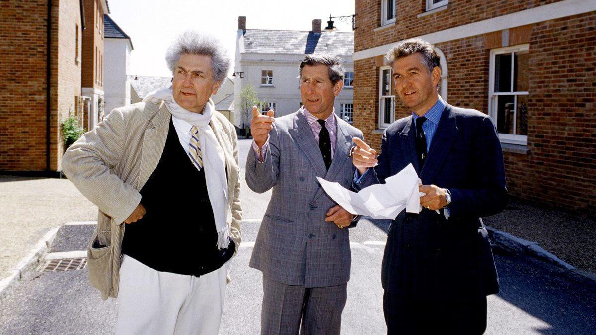 Prince Charles, as he was then known, touring Poundbury with architect Léon Krier and development manager Andrew Hamilton in 1999. He wears a checked double-breasted suit and is pointing at an unseen part of the development.