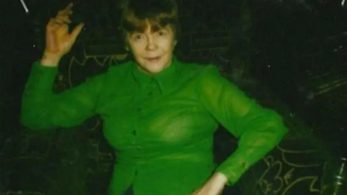 A woman in a green top 