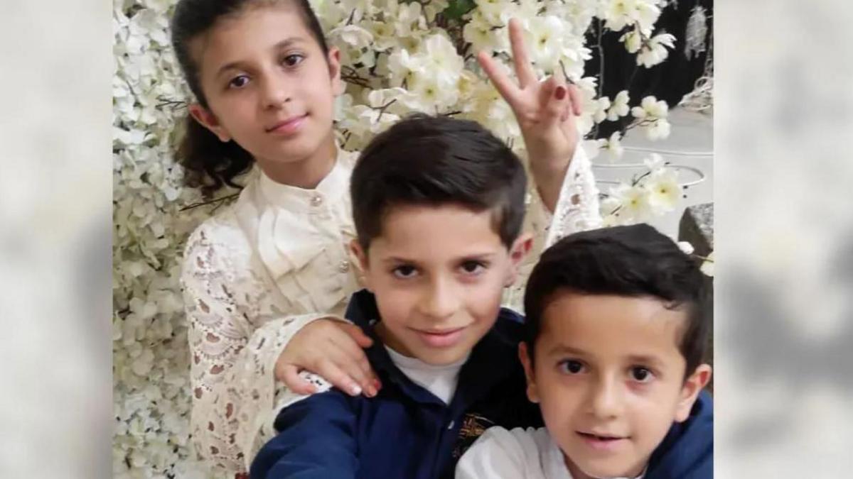 Ahmed's niece and two nephews Tamim, Mohamad and Malak Bashir pictured in a group with a white flowery background.