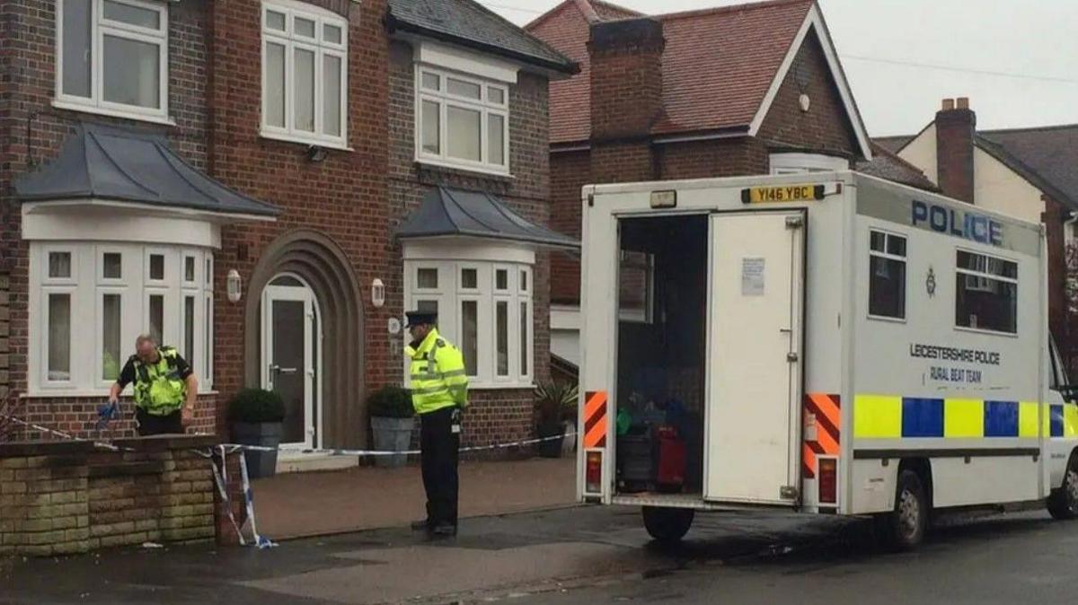 A police cordon outside a house in Leicester