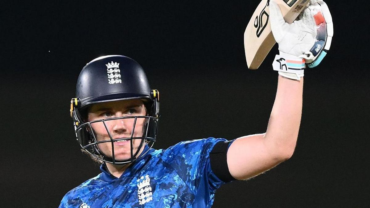 Nat Sciver-Brunt raises bat after reaching century