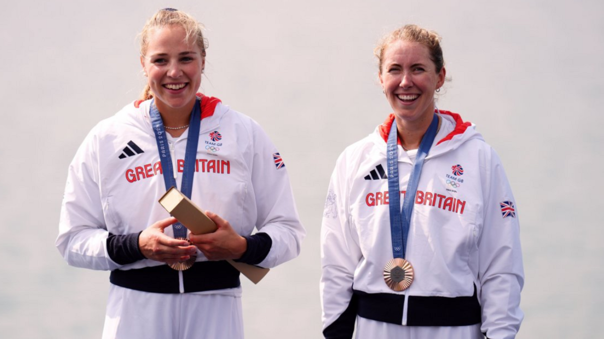 Mathilda Hodgkins-Byrne (left) and Rebecca Wilde (right) wearing their Team GB kit with their bronze medals at the Paris Olympics