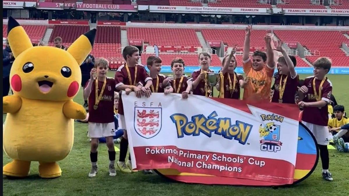 Corpus Christi Catholic Primary Academy lifting the U11 Schools Cup.
