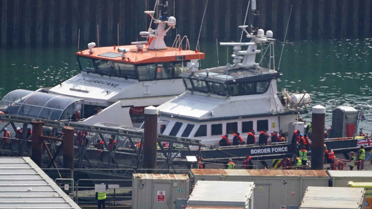 Migrants arriving by boat into Dover