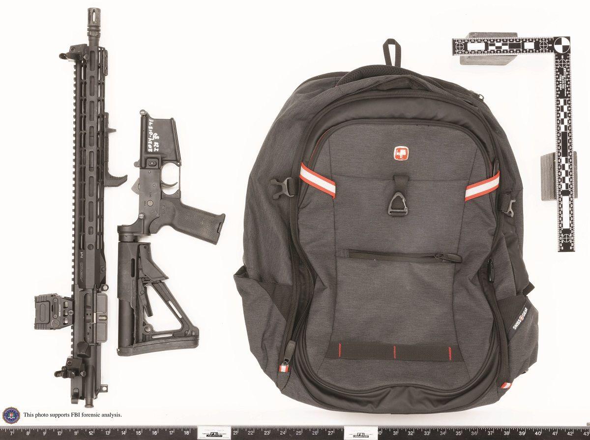 A backpack and a rifle in several pieces