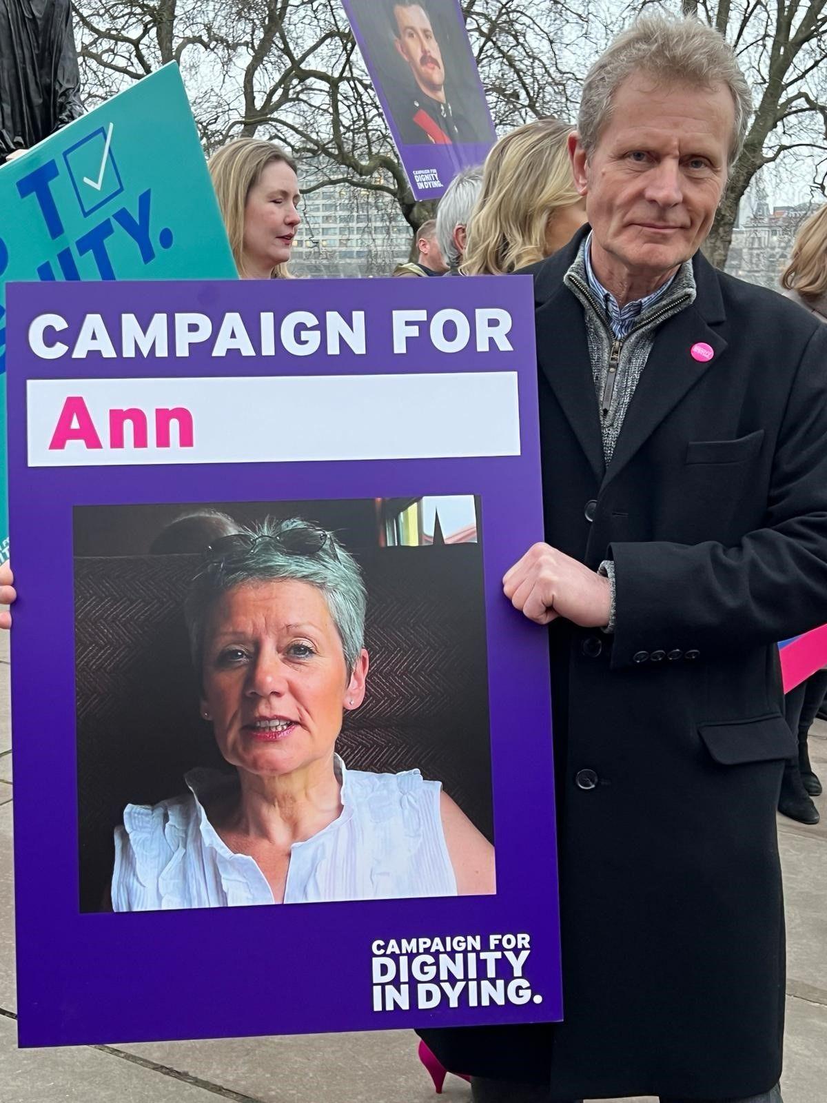 Warwick Jackson with a picture of his wife Ann