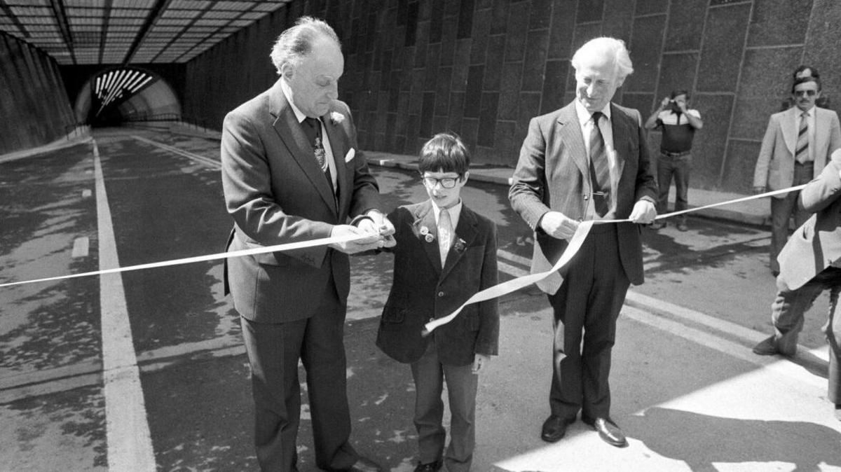 Nine-year-old Glen Martin opening the second Dartford Tunnel by cutting a ribbon