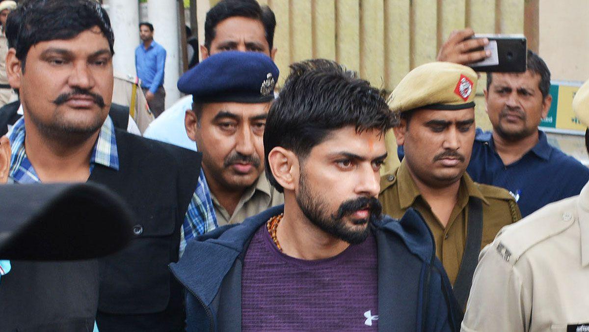 Lawrence Bishnoi being escorted by police before appearing in Panchkula Court, on 13 November, 2019 in Panchkula, India.