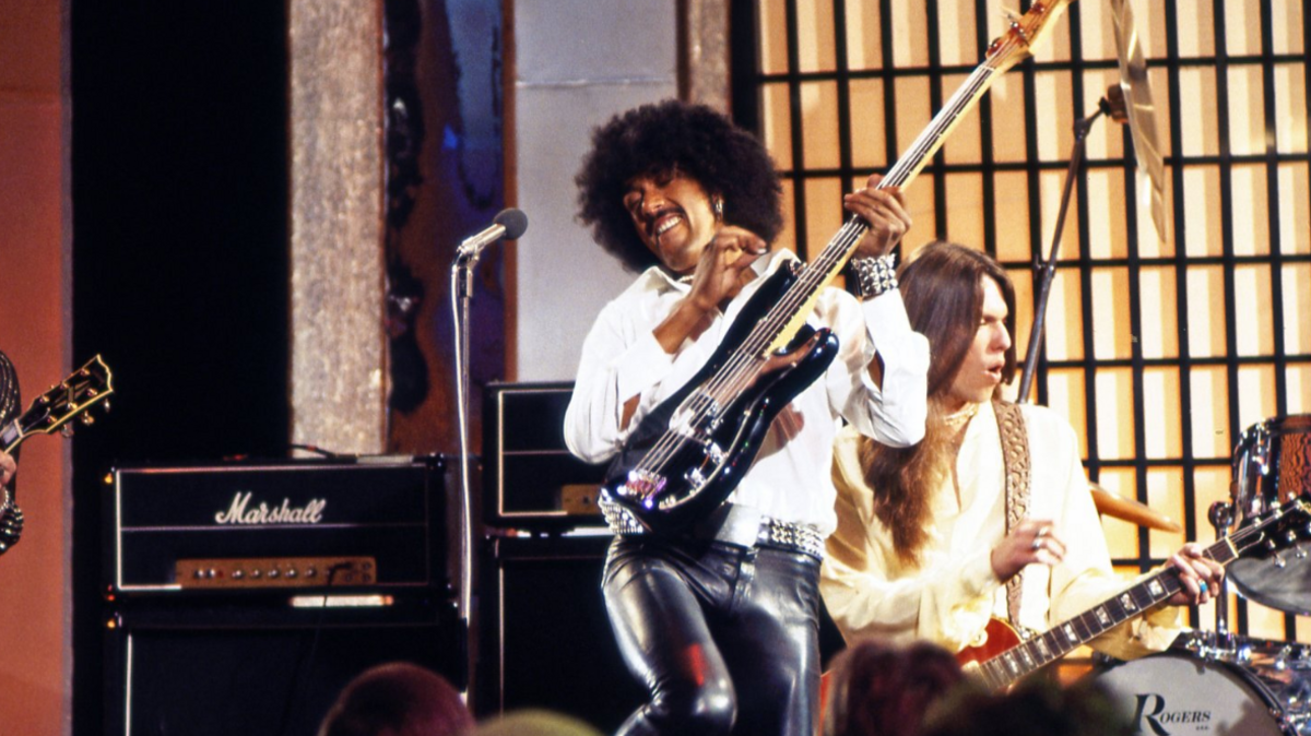 Phil Lynott playing guitar with Thin Lizzy