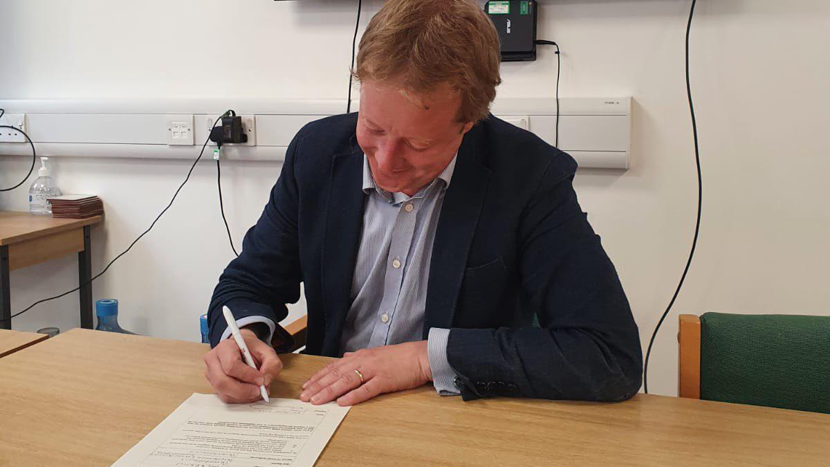 Paul Bristow signing Peterborough's Levelling Up bid in June