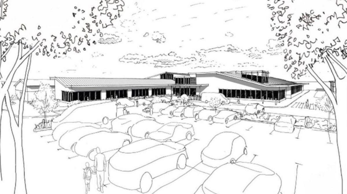 An artists impression showing how a new £28m pool facility could look, with vehicles in a car park and a building in the distance