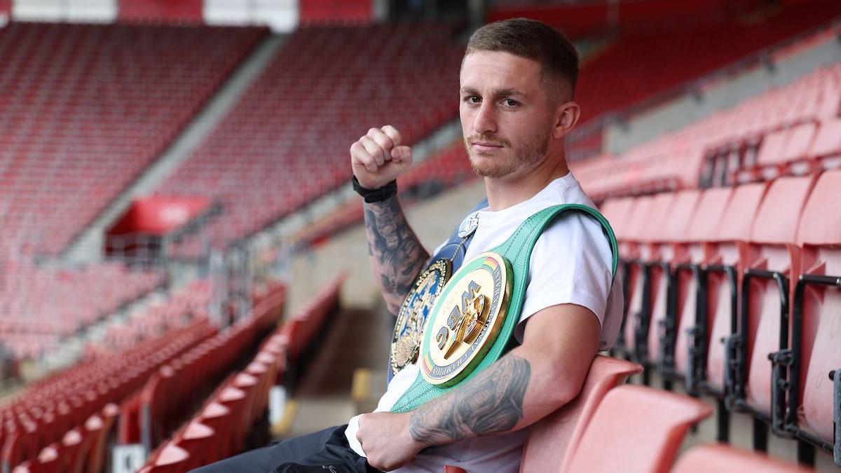Ryan Garner poses for a photo while sat in St Mary's Stadium