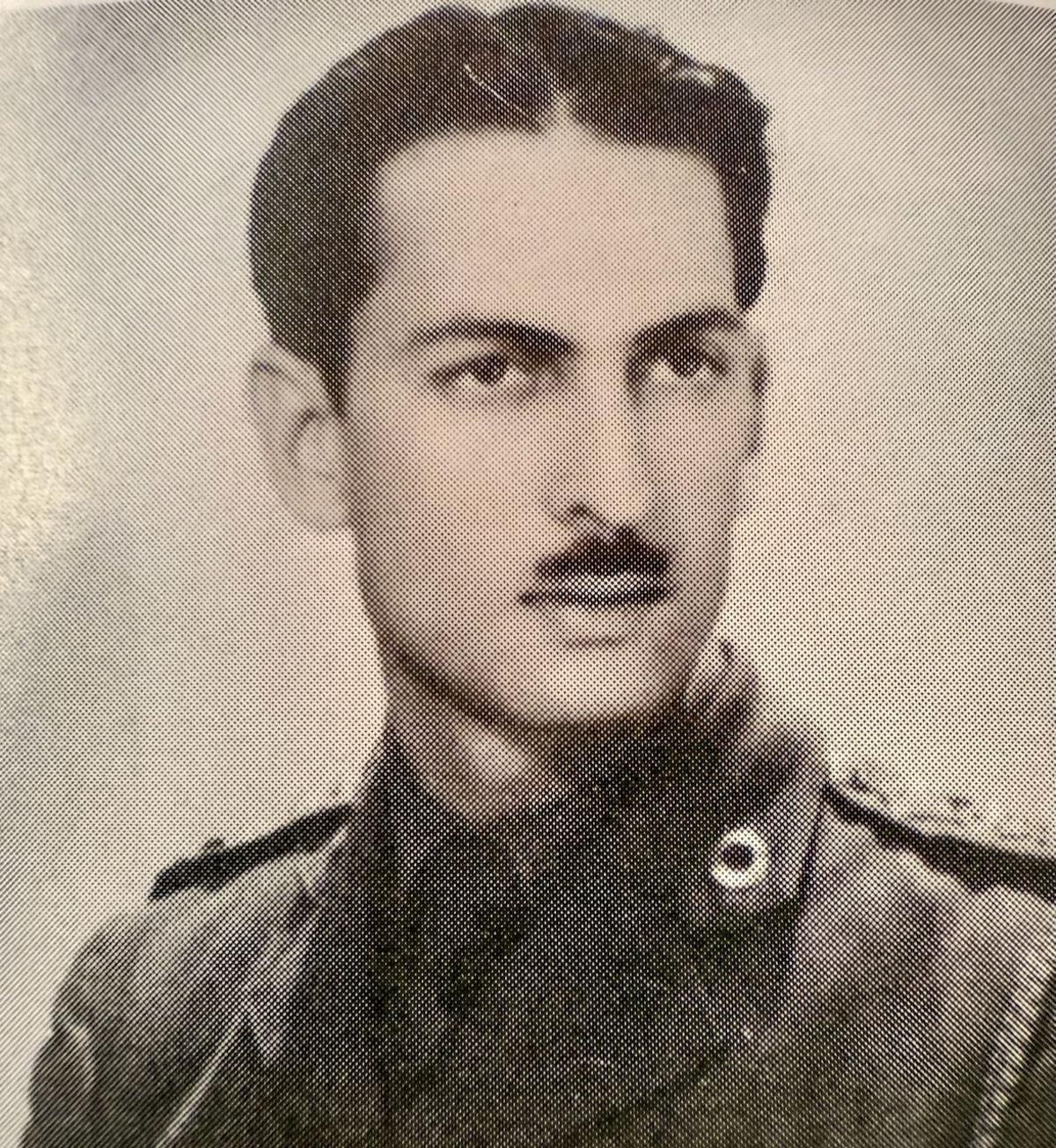A black and white picture of Yavar as a young man, with a serious expression 