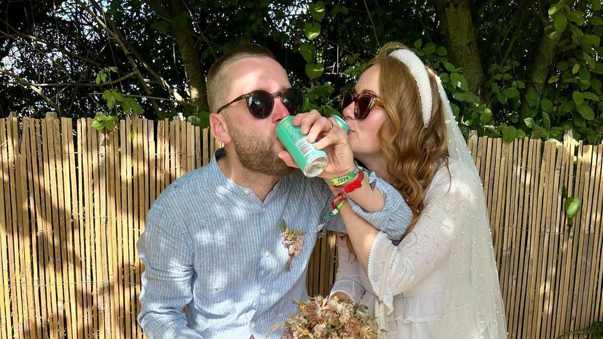 Alex Bee and Liam Barnett enjoy a drink after their wedding