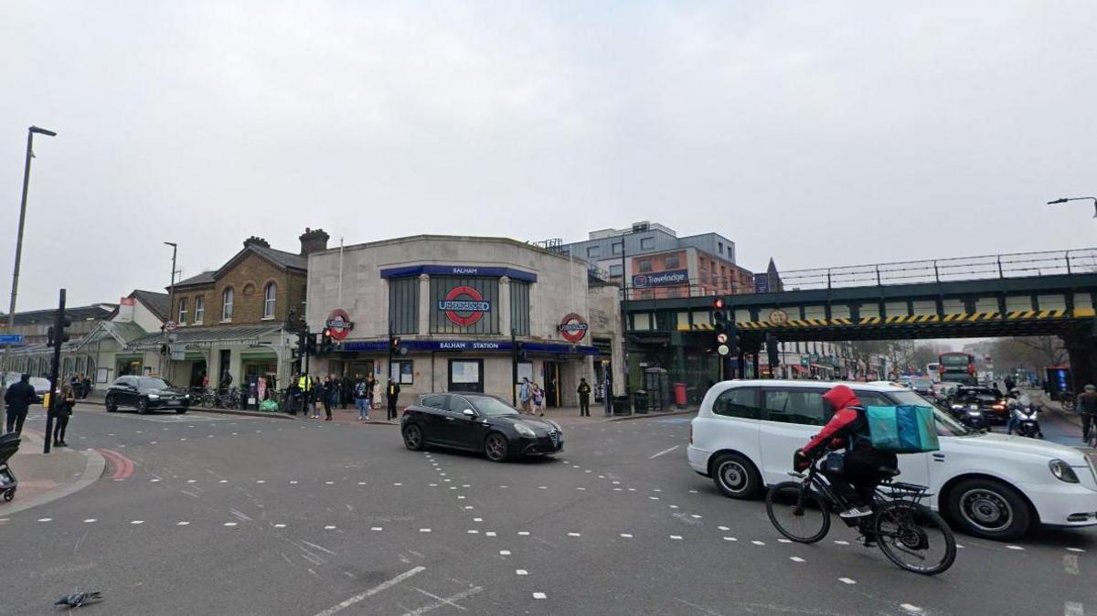 A general view of Balham High Road, showing Balham Underground station and a busy crossroads.