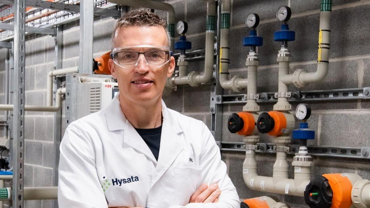 Paul Barrett, the Dublin-born chief executive of the Australian green energy firm Hysata wearing protective glasses and a white lab coat