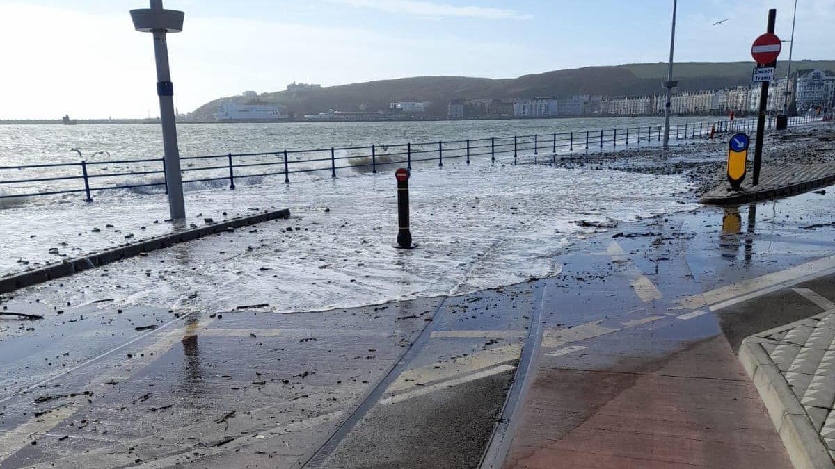 Sea water and stones washed onto Douglas Promenade