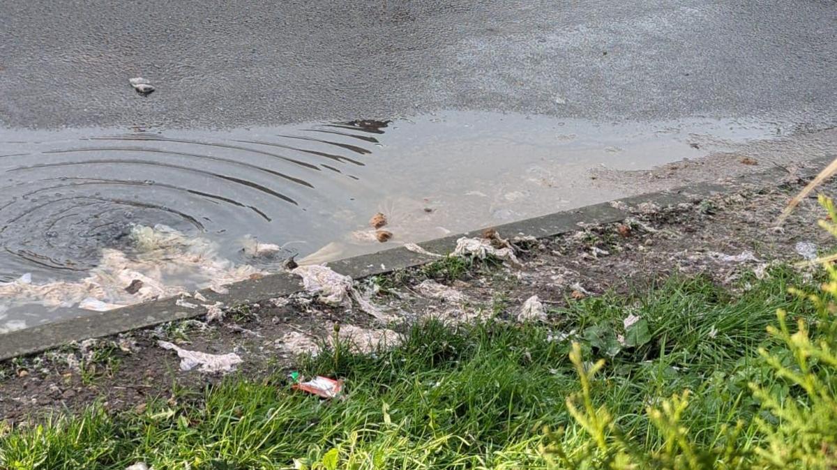 Waste in flooding in Warwick Road, Whetstone, Leicestershire