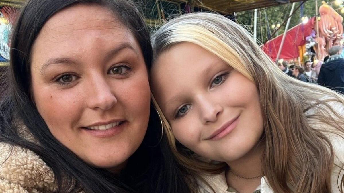 Mia pictured with her mother Chloe Hayes, both  a smiling with long hair