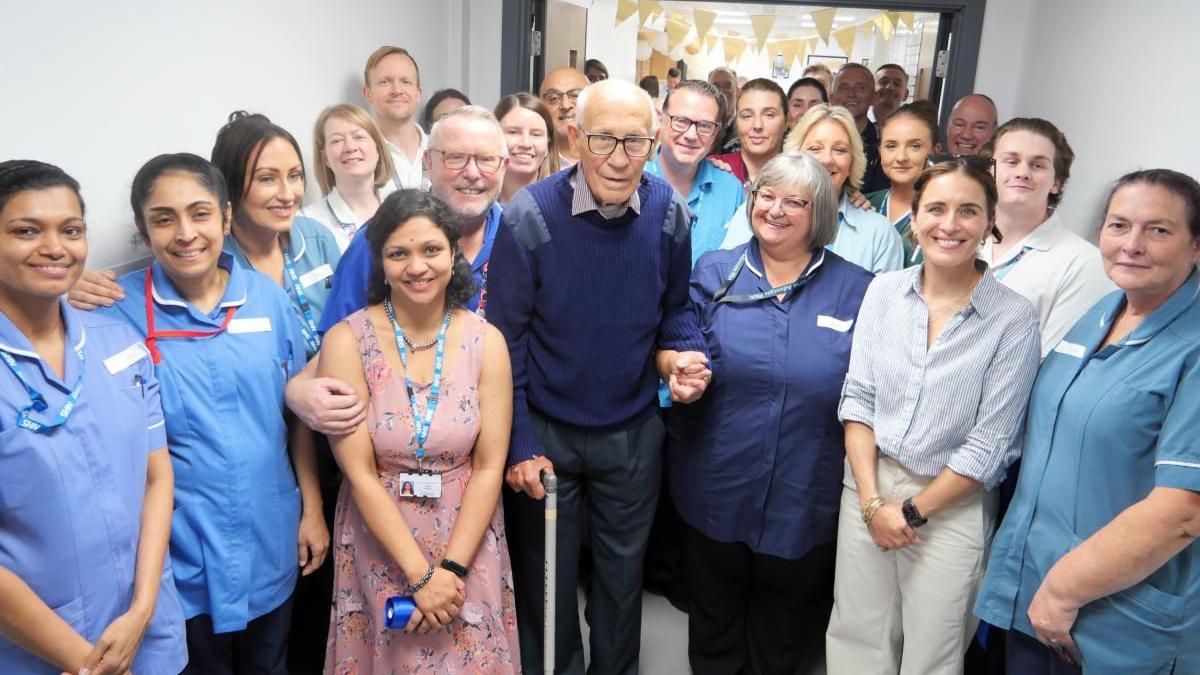 Staff and patients gathered at the entrance of the unit, with actor Vicky McClure