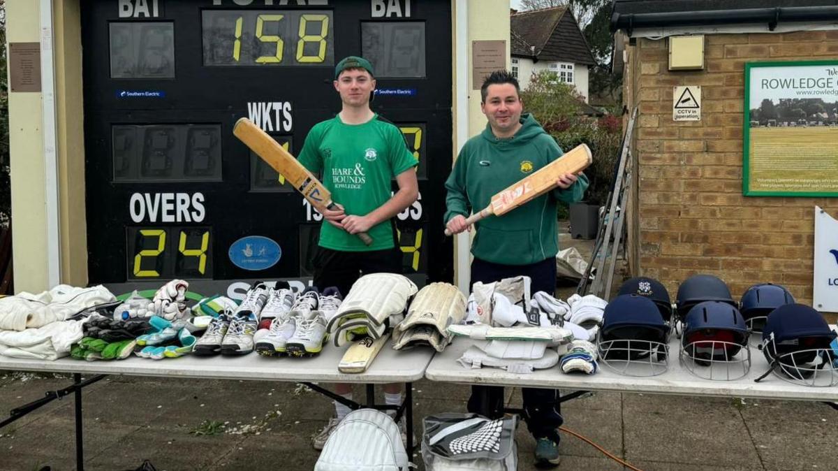 Bats, shoes, pads and helmets are spread out on tables