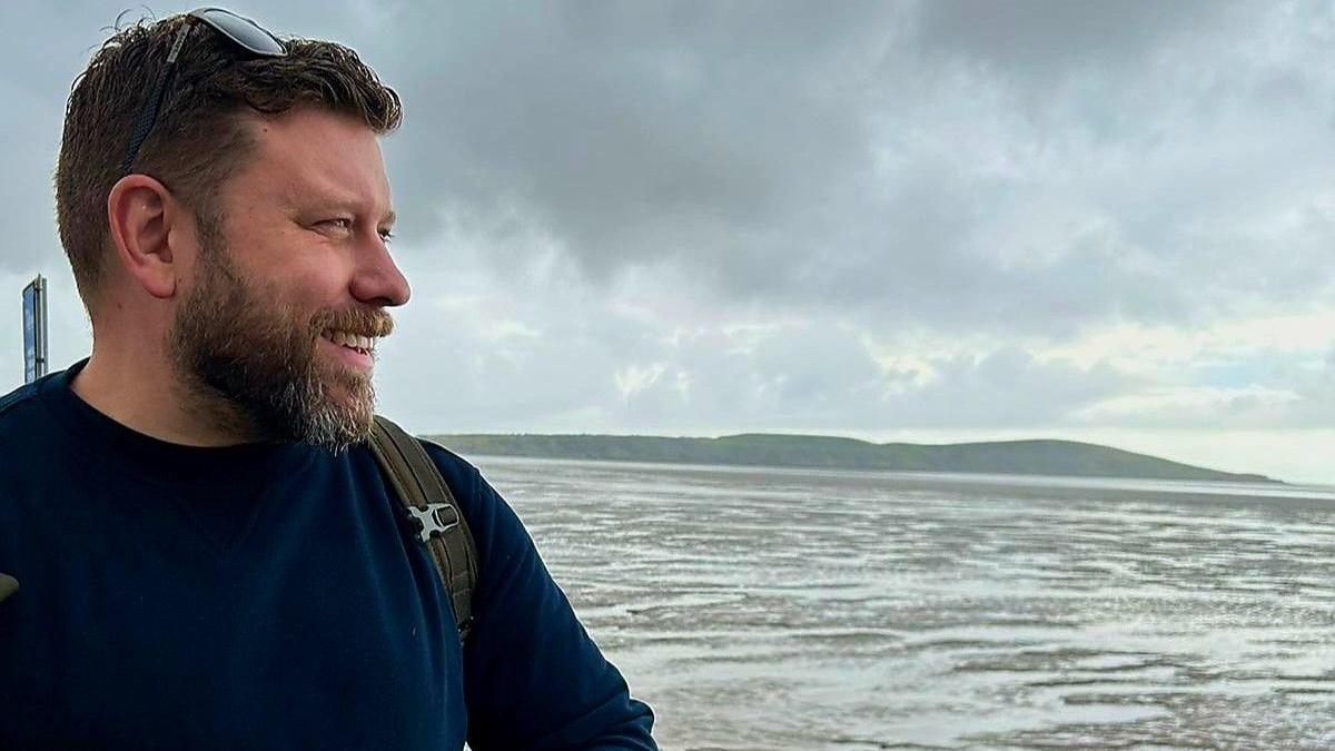 Matt Knibb looking out over water