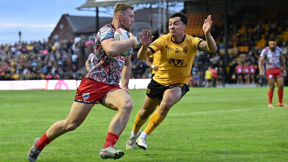 Jack Hughes runs in a second half try for Leigh as Castleford's defence tries to get across in vain