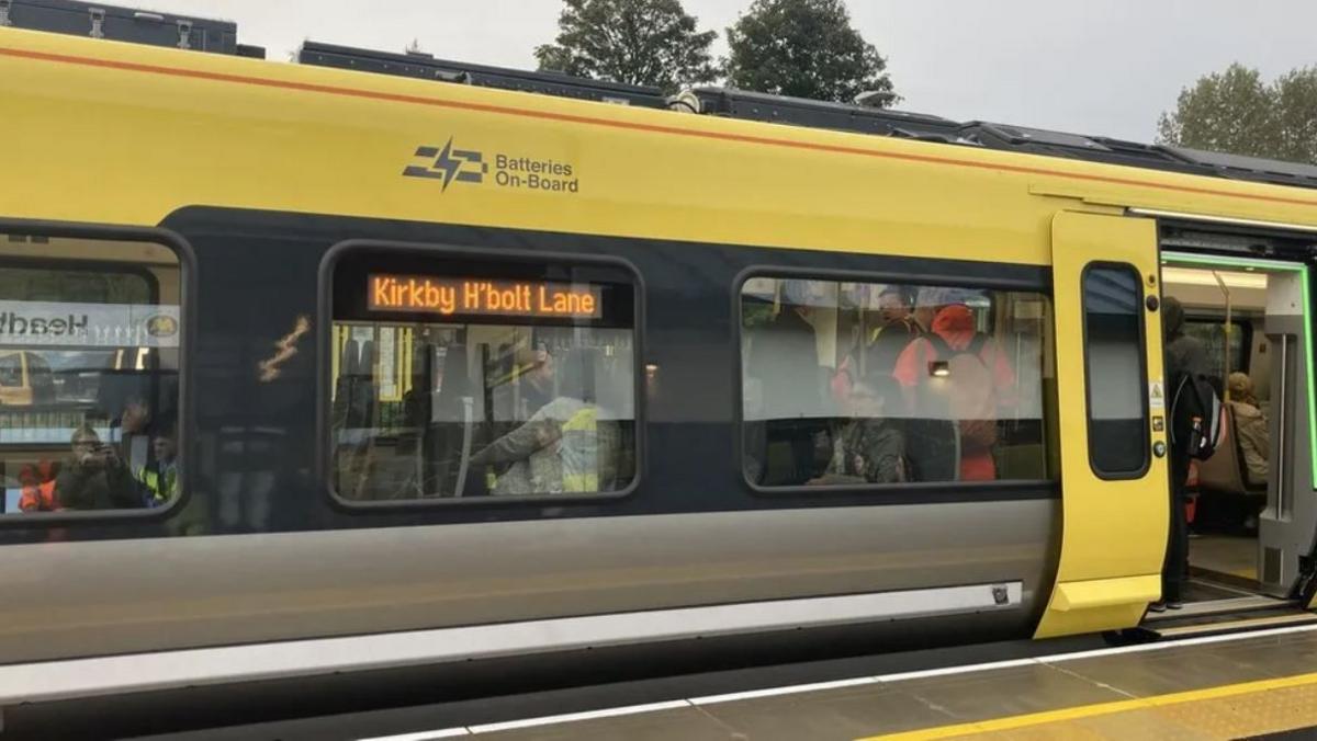 Side view of a battery powered train which between Kirkby and Headbolt Lane