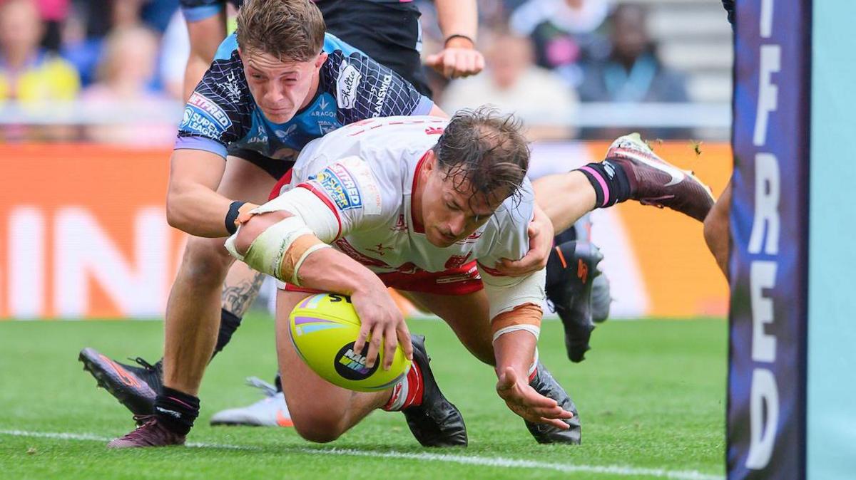 Hull KR's Jai Whitbread scores a try against Hull FC