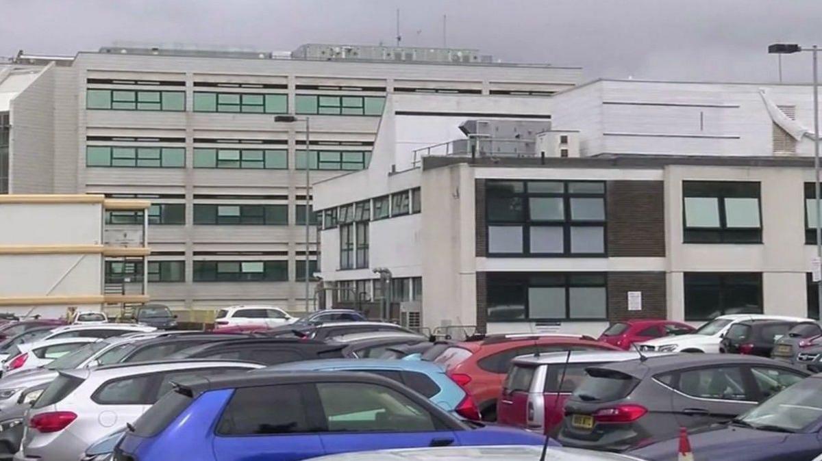 A carpark outside a hospital.