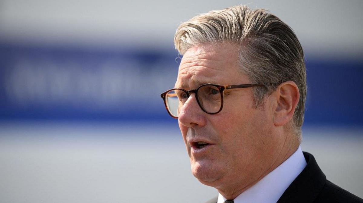 Britain's Prime Minister Keir Starmer is interviewed after being shown the procedures carried out by search teams as they check vehicles arriving in the ferry port from Italy, in Tirana, Albania, May 15, 2025, in Tirana, Albania.