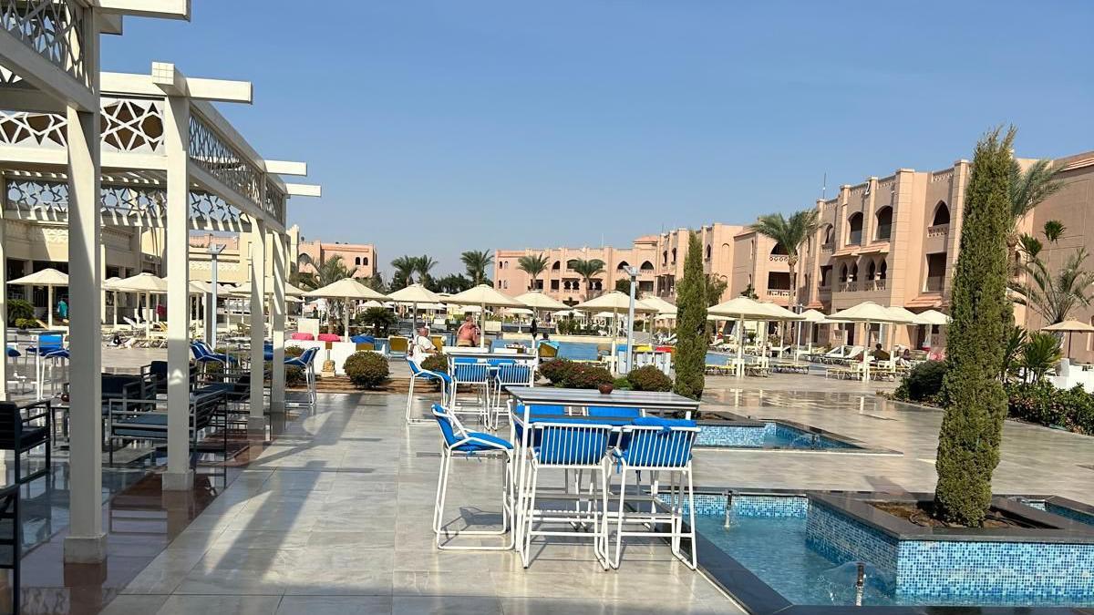 A pool area showing a blue sky and seats