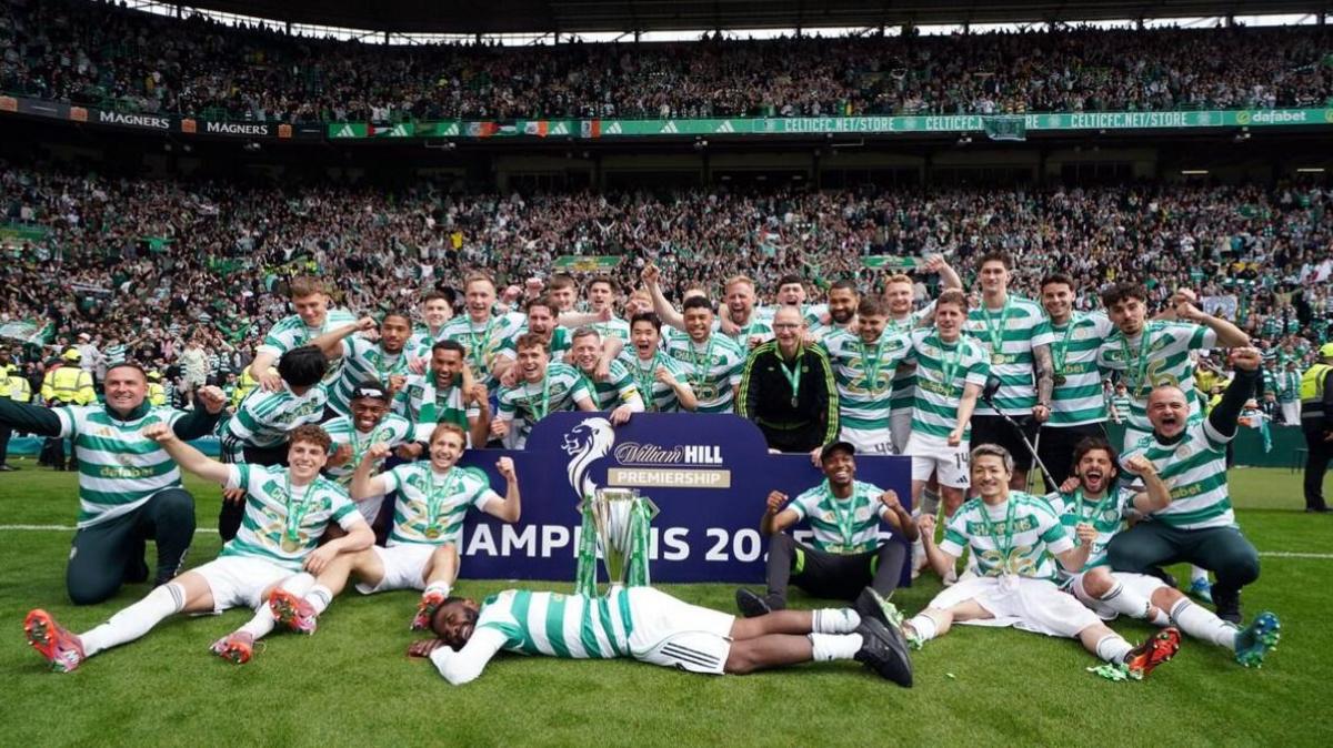 Celtic players celebrate securing the title on the final day of the season