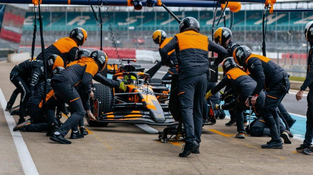 McLaren crew tend to Lando Norris in the new 2025 car at Silverstone 