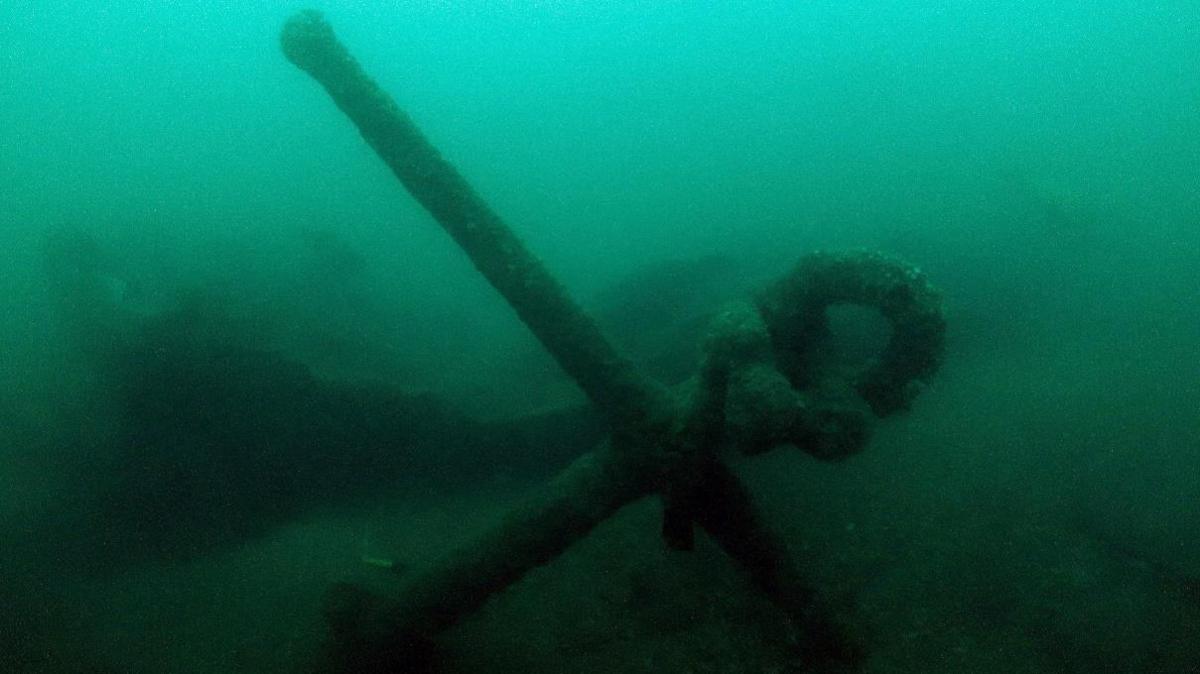 A ship's anchor at the bottom of the seabed