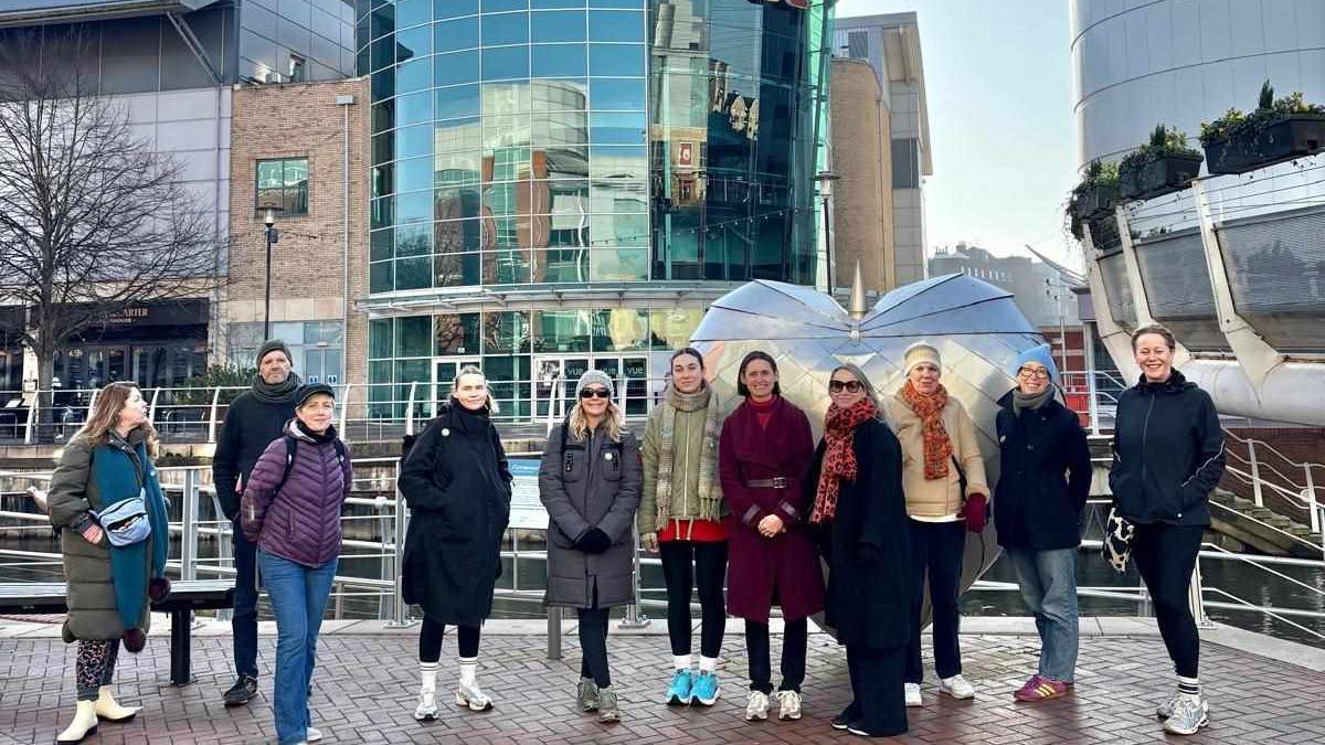 Eleven people standing in front of the Vue in Reading, taking part in a charity walk.