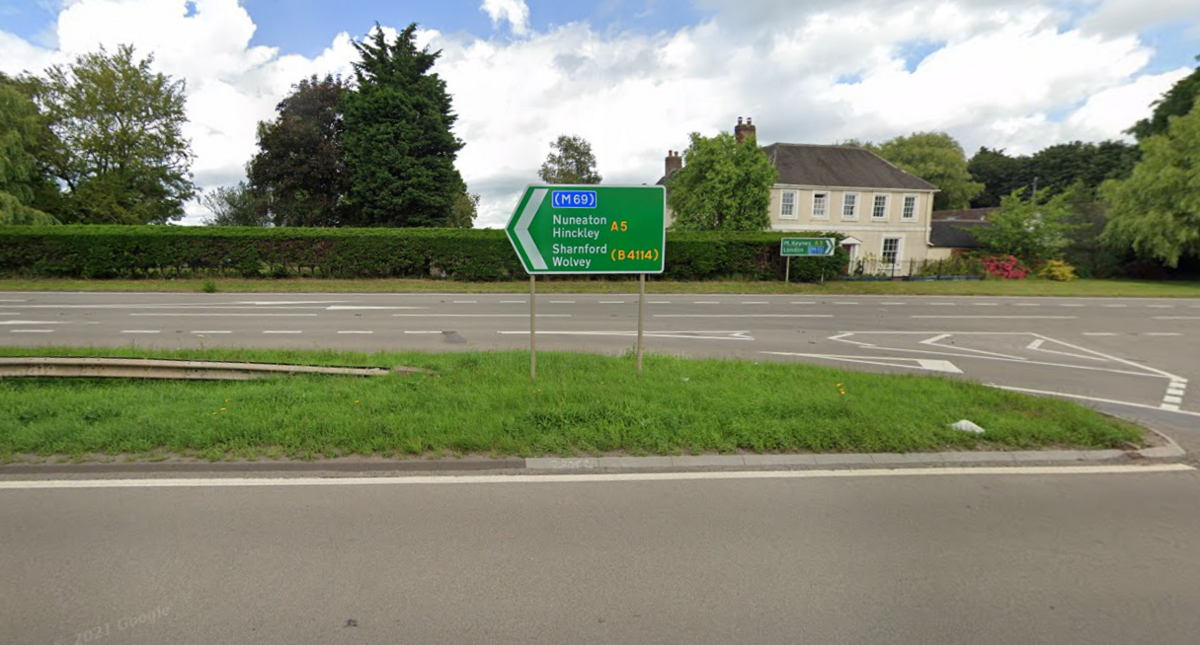 A road sign on the A5 at High Cross