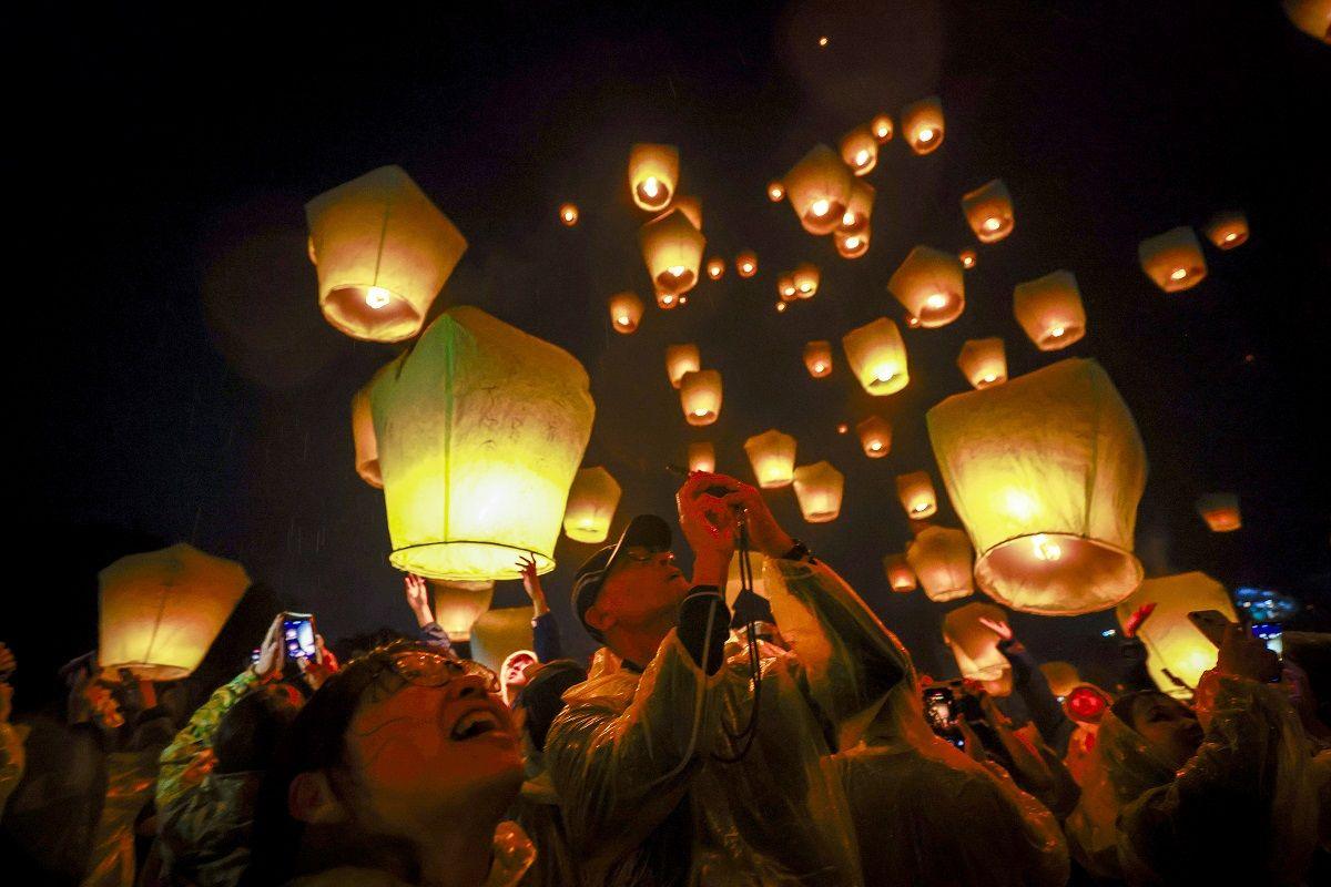 People releasing lanterns during celebrations in Pingxi, New Taipei City, Taiwan.