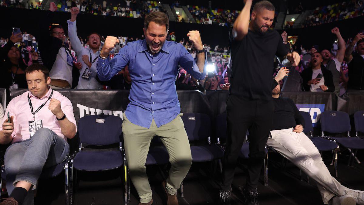 Eddie Hearn and Tony Bellew celebrate England's winning penalty in the shoot-out against Switzerland