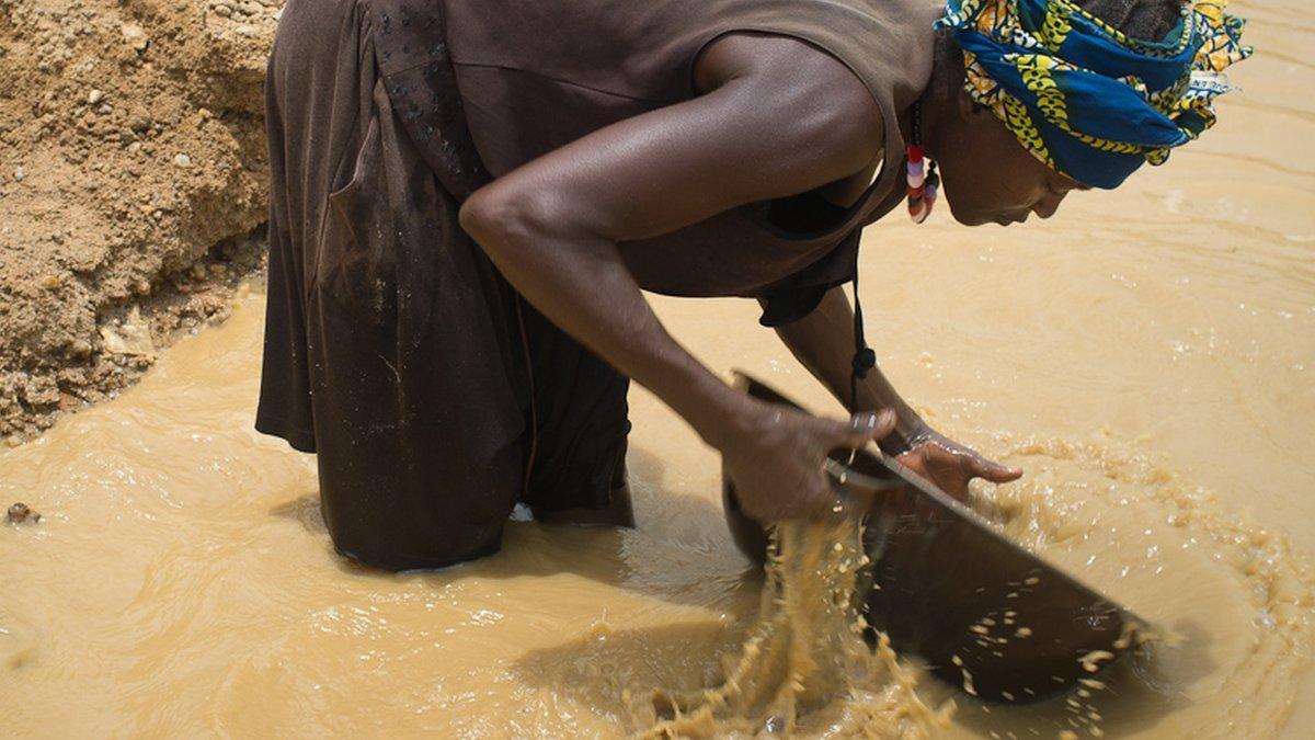 Woman panning for gold