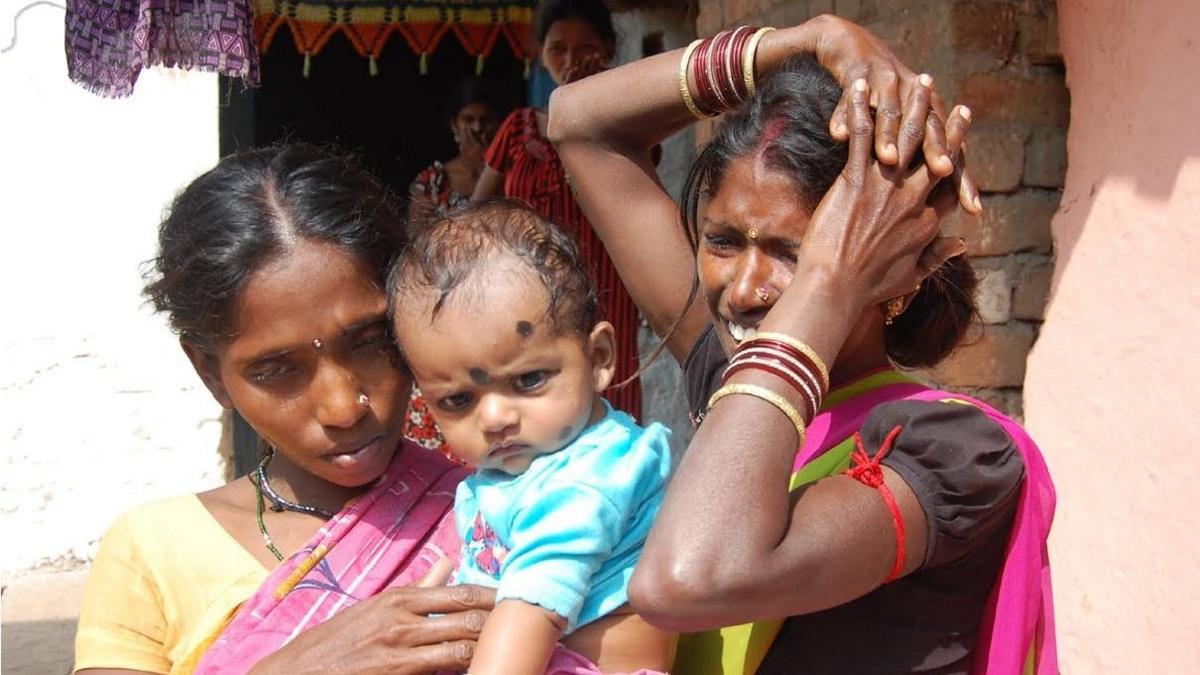 Nandini (left) holding Rekha's baby, and Anjani (right)