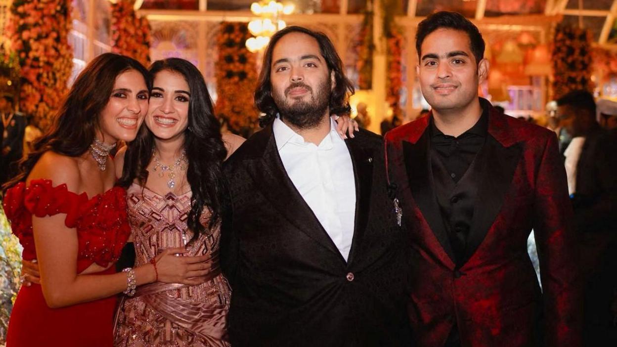 Akash Ambani and Anant Ambani, sons of Mukesh Ambani, the Chairman of Reliance Industries, pose with Shloka Mehta Ambani, wife of Akash, and Radhika Merchant, daughter of industrialist Viren Merchant, during pre-wedding celebrations of Anant and Radhika in Jamnagar, Gujarat, India, March 2, 2024. Reliance