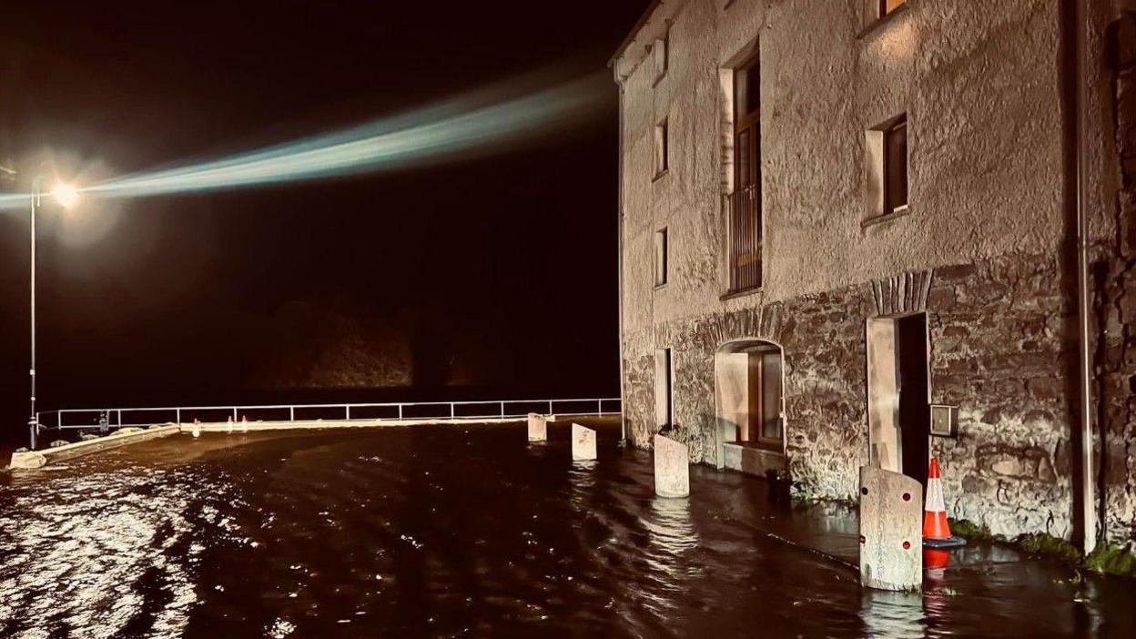 The old warehouses at the Quayside in Ramelton pictured with flood water outside the building near Lough Swilly