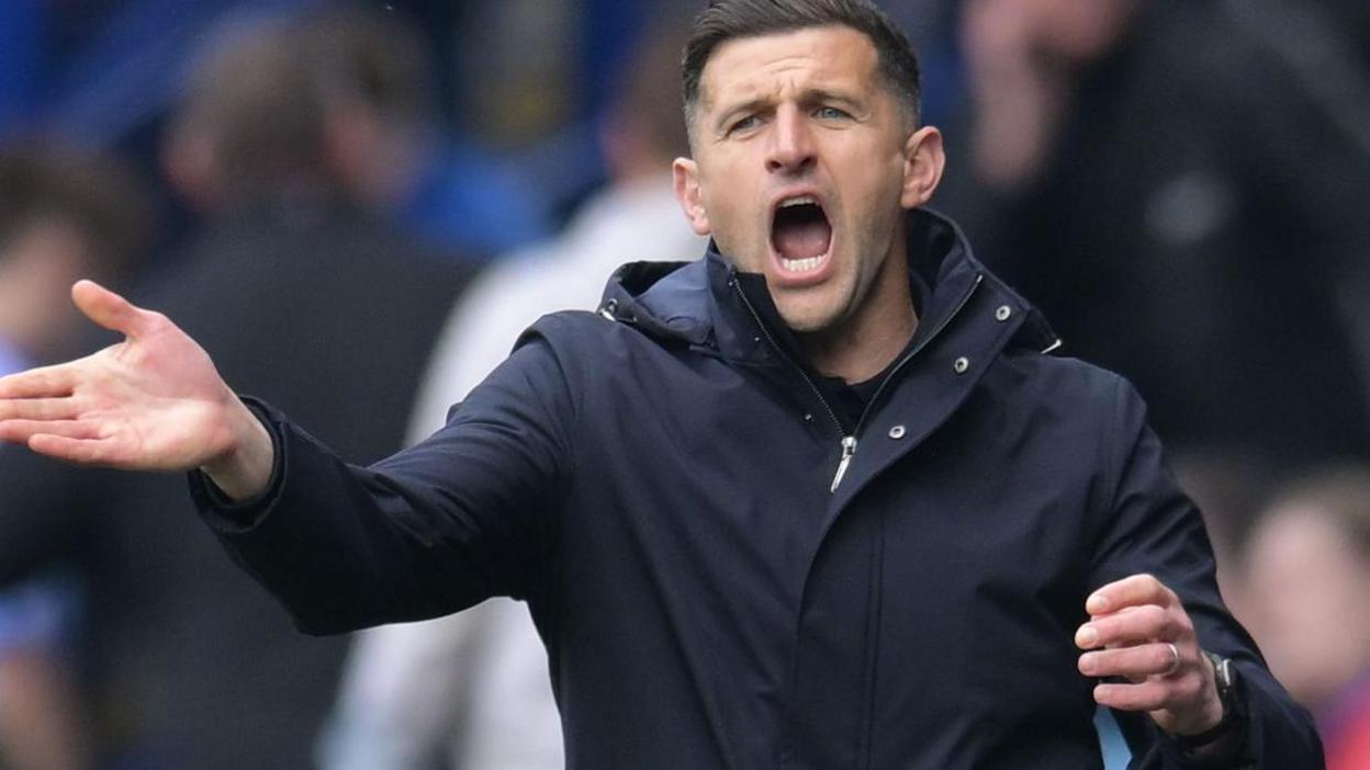 John Mousinho shouts